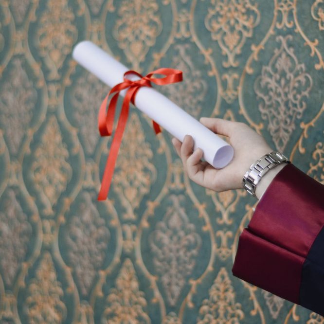 person holding diploma
