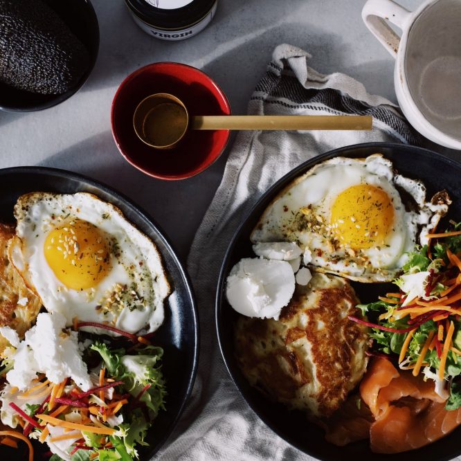 cooked food on black ceramic plates