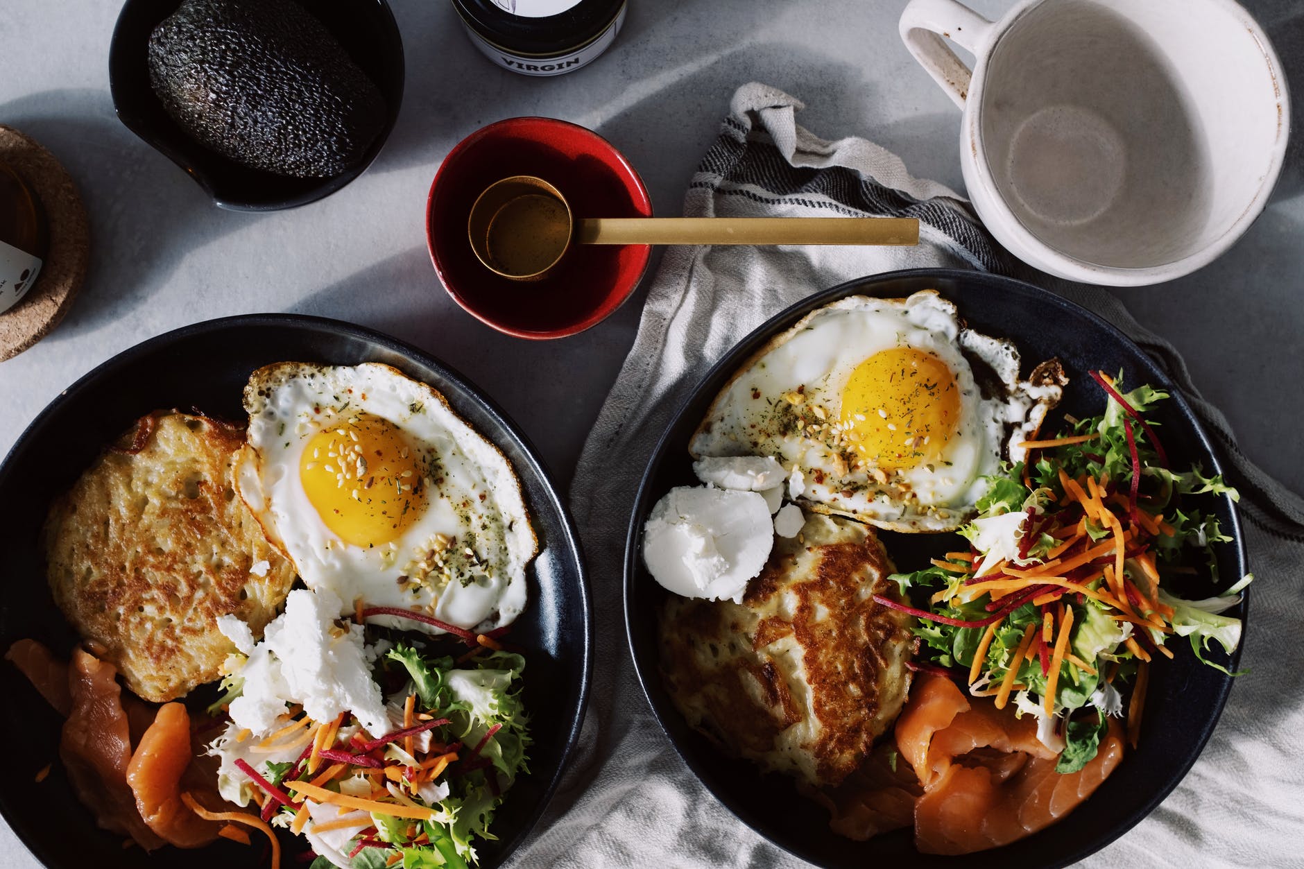 cooked food on black ceramic plates